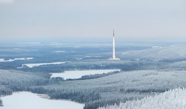 Esrange rocket launch as seen from distance, surrounded by a frosty winter landscape Esrange rocket launch as seen from distance, surrounded by a frosty winter landscape