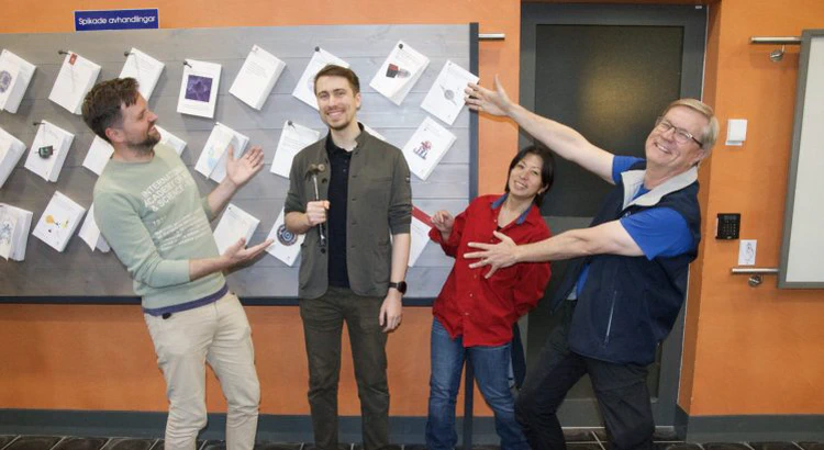 Joshua Dreyer is celebrated by his supervisors after the nailing ceremony