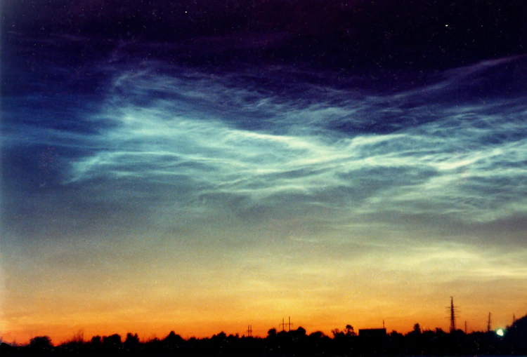 Noctilucent clouds over skyline